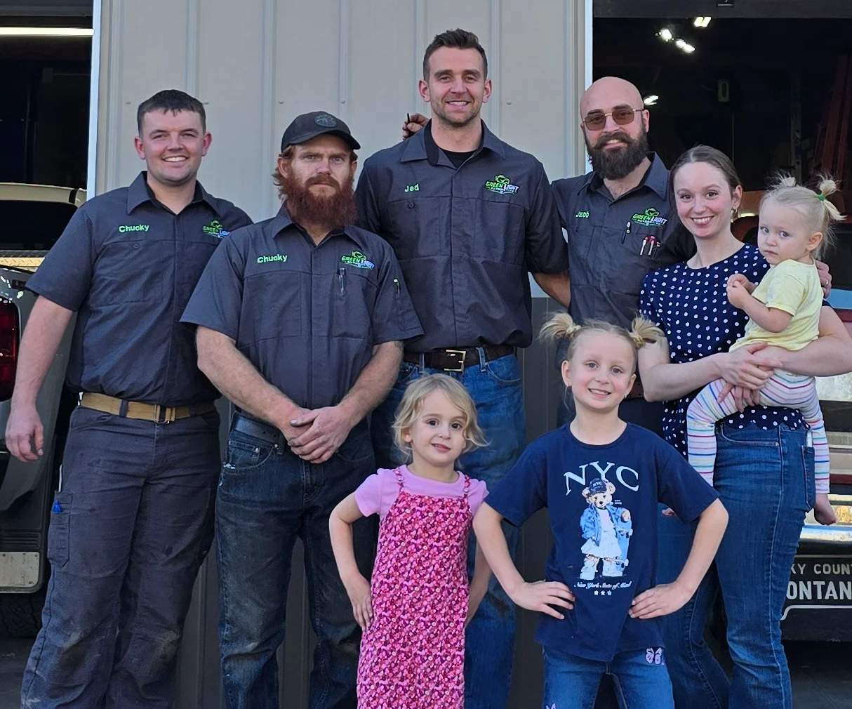 The Green Light Automotive team and family in front of the Rexburg shop