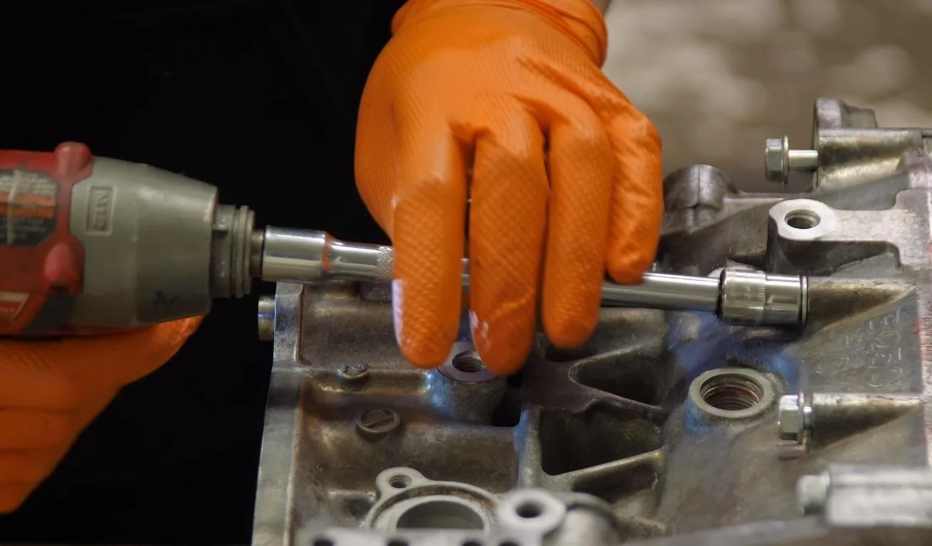 Mechanic working on a vehicle component